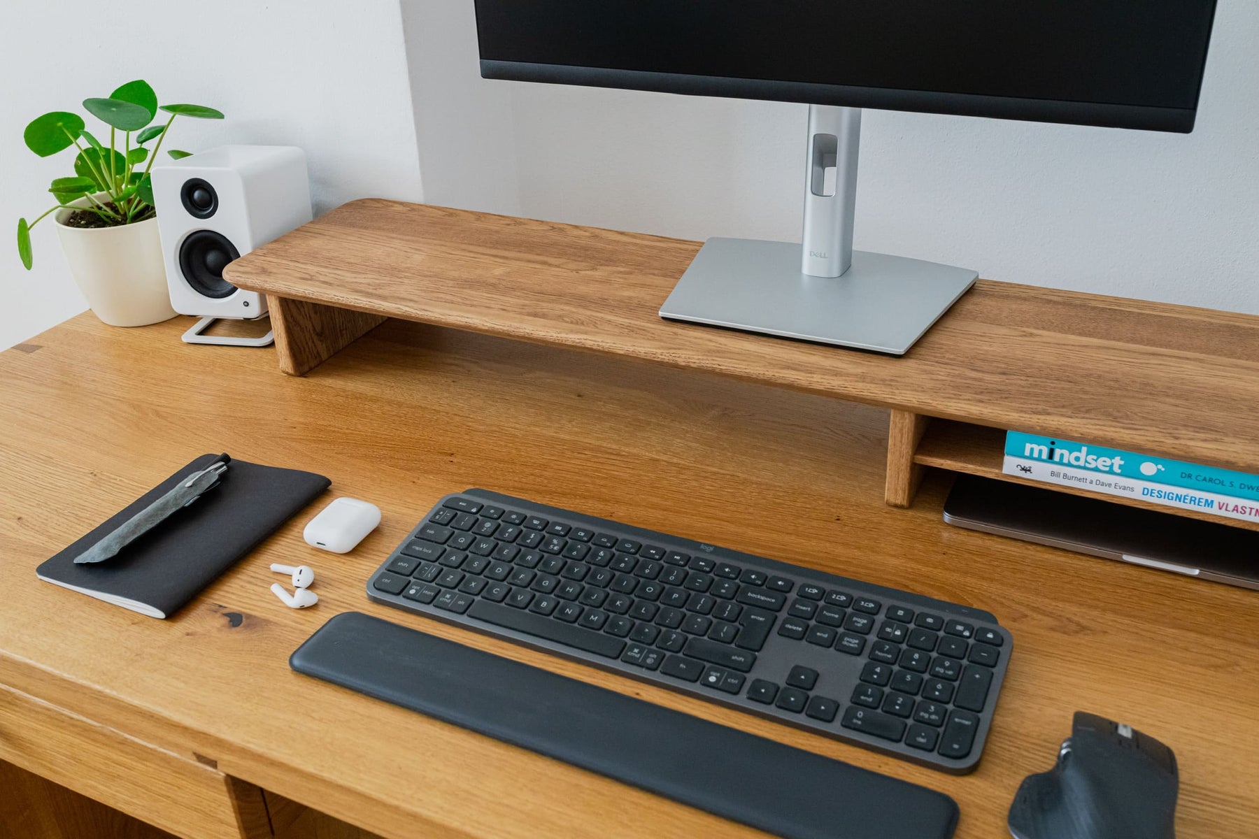 Walnut Grindwood monitor stand organizing a desk
